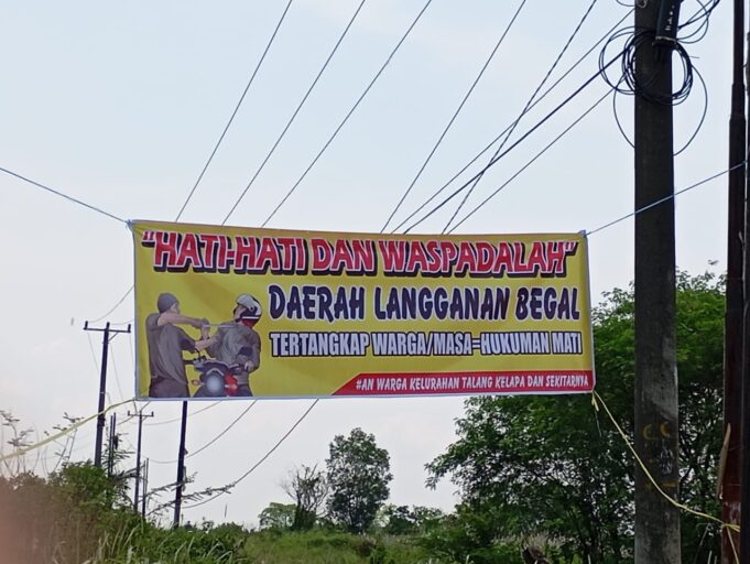 Daerah Langganan Begal, Perangkat RT di Jalan Sukasari Pasang Spanduk Peringatan